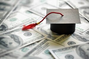 Graduation cap over money
